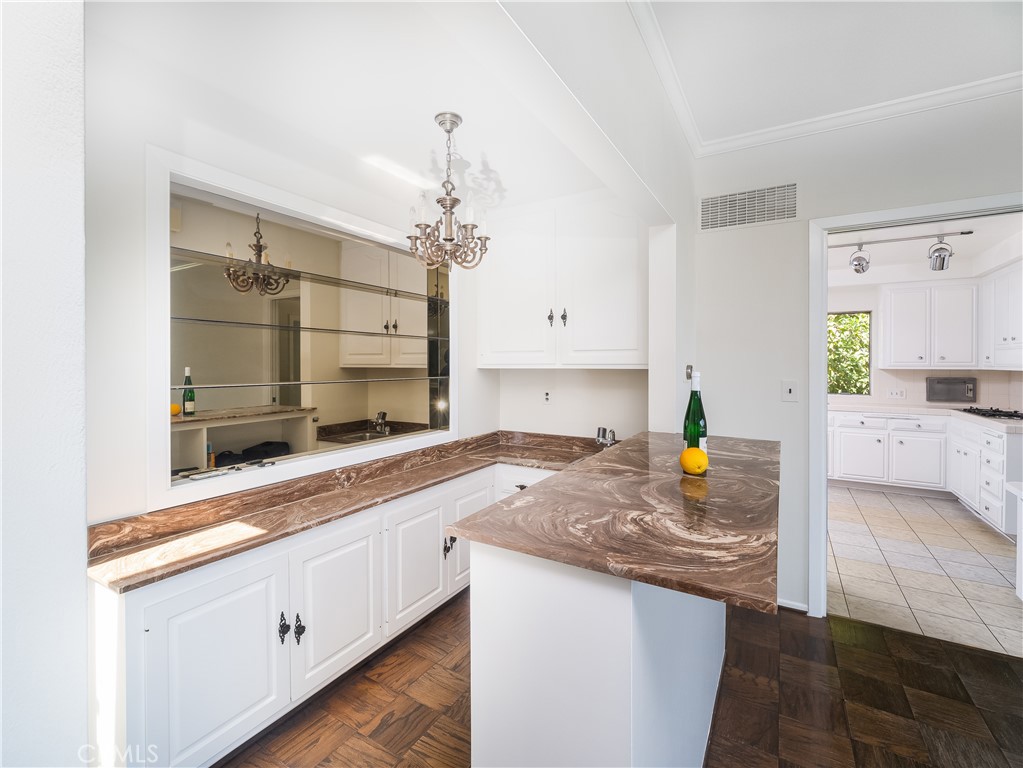20193 Adele Drive Woodland Hills, CA 91364 - Photo 8 of 38 a kitchen with sink cabinets and counter space