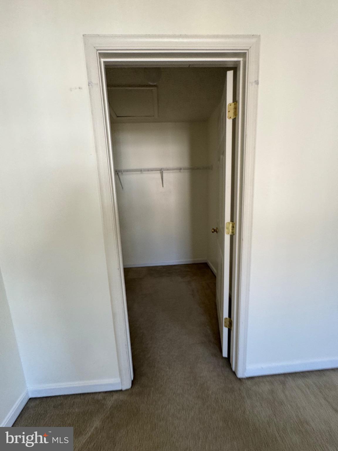 1604 Briarview Court, Unit 64 Severn, MD 21144 - Photo 4 of 24 Spacious closet with clean, neutral tones.