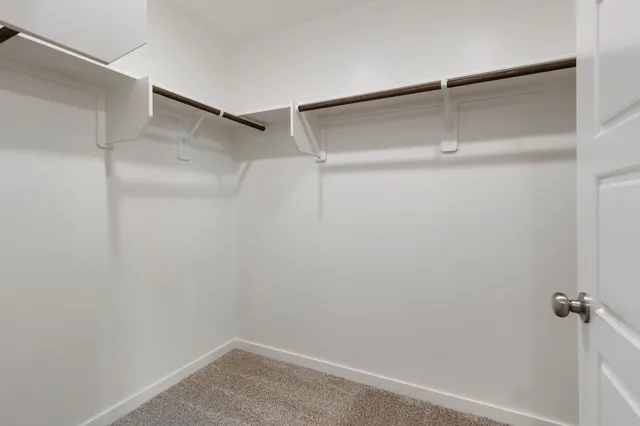 a view of an empty walk in closet