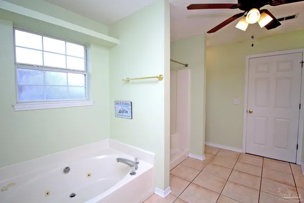 a bathroom with a granite countertop sink a mirror and a