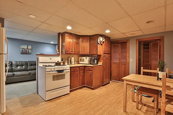 a kitchen with stainless steel appliances granite countertop a stove and a refrigerator