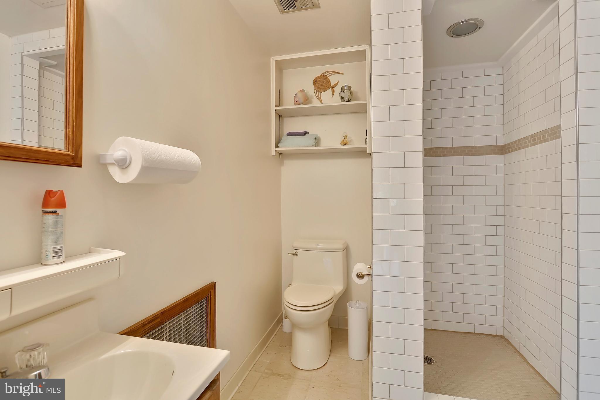 464 Friendship Road Friendship, MD 20758 - Photo 17 of 29 a bathroom with a toilet and a sink