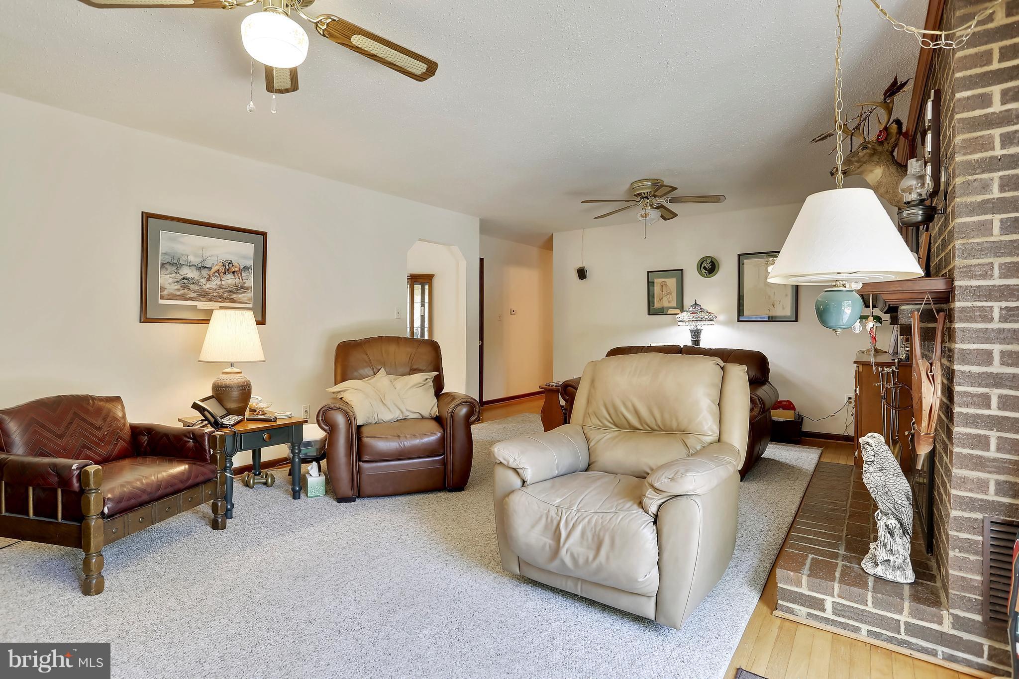 464 Friendship Road Friendship, MD 20758 - Photo 18 of 29 a living room with furniture a couch and a chandelier