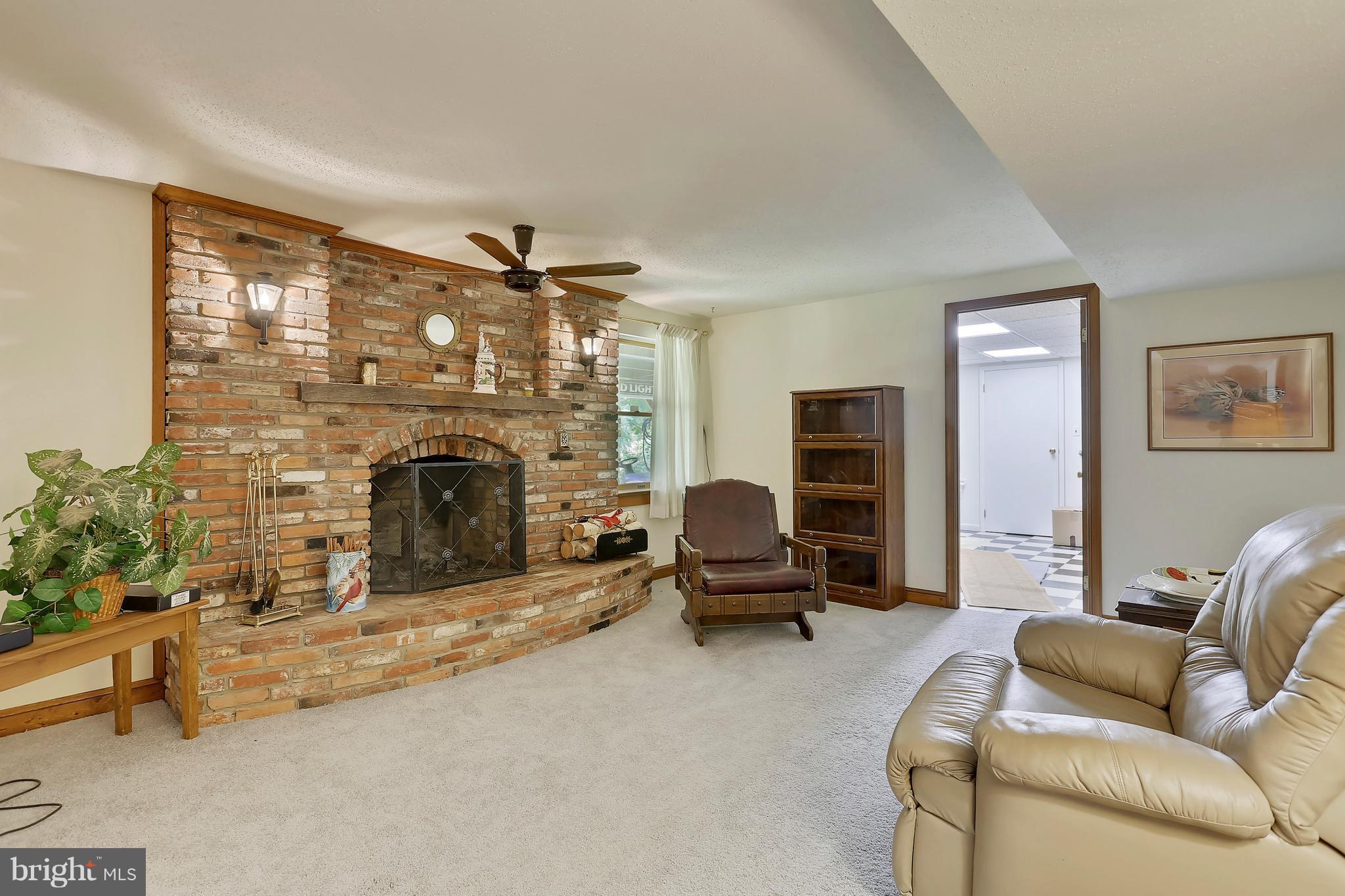 464 Friendship Road Friendship, MD 20758 - Photo 22 of 29 a living room with furniture and a fireplace