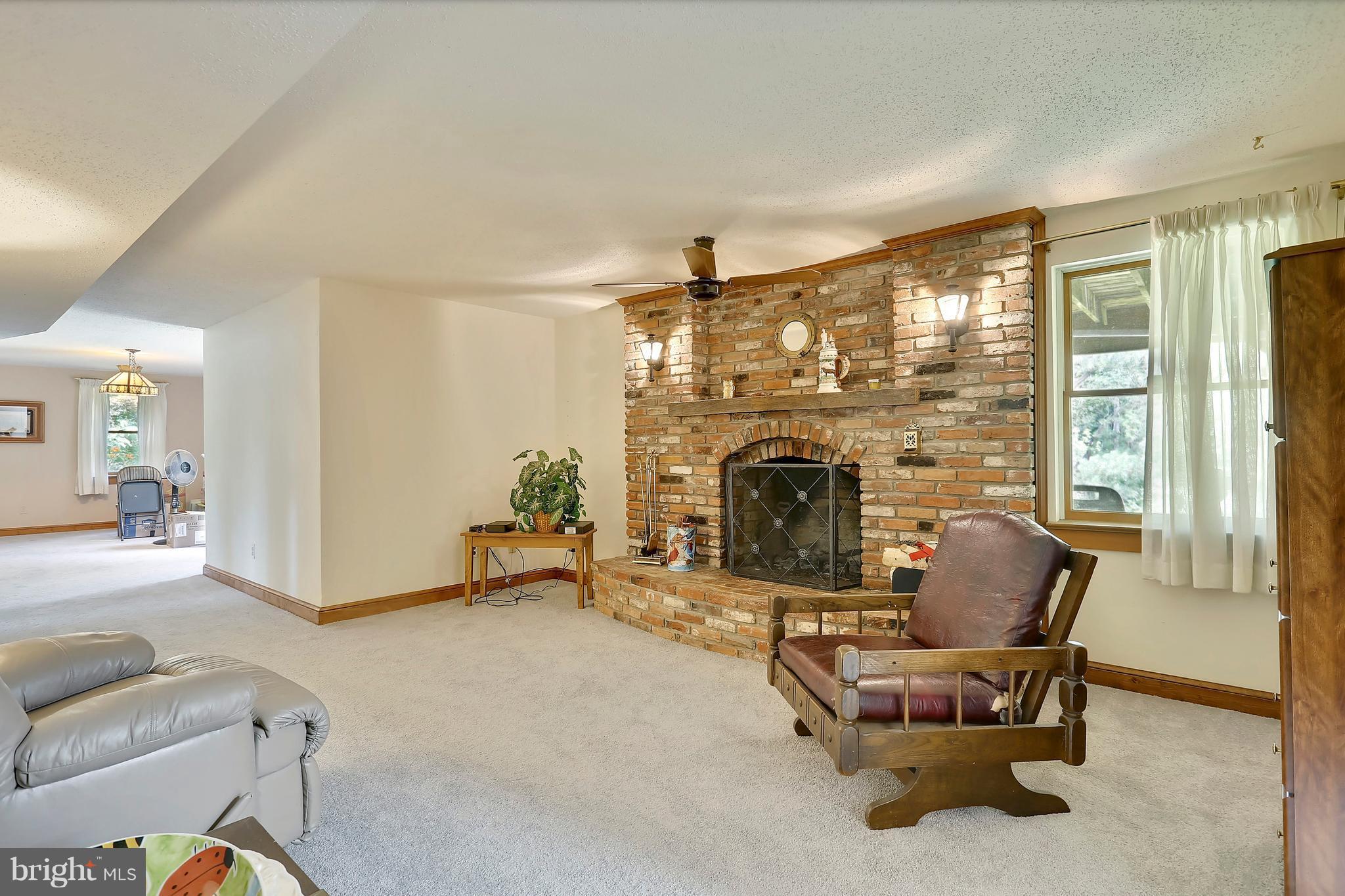 464 Friendship Road Friendship, MD 20758 - Photo 23 of 29 a living room with furniture and a fireplace