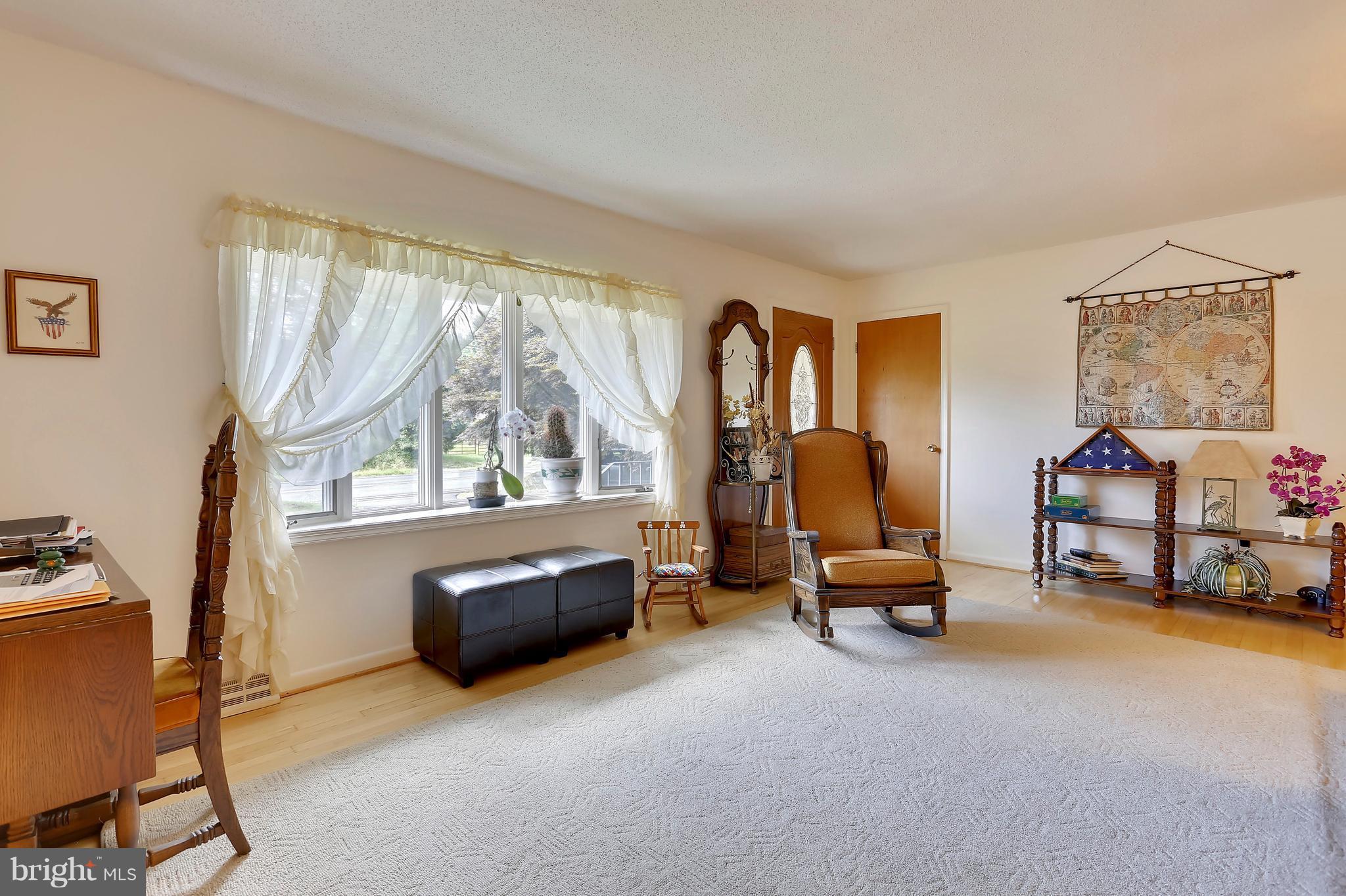 464 Friendship Road Friendship, MD 20758 - Photo 9 of 29 a living room with furniture and a large window