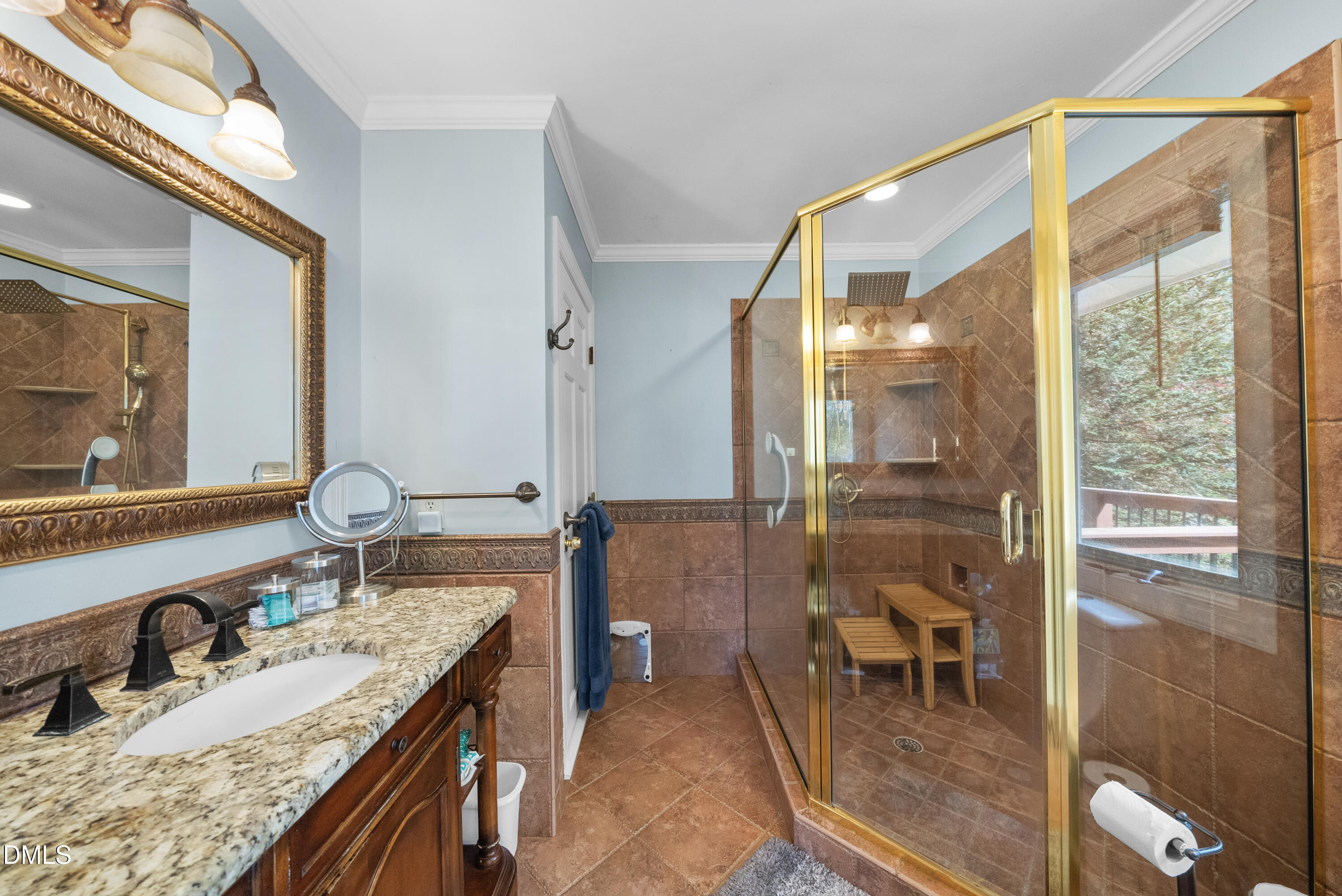 6200 Splitrock Trail Apex, NC 27539 - Photo 23 of 64 a bathroom with a granite countertop sink a mirror and a shower