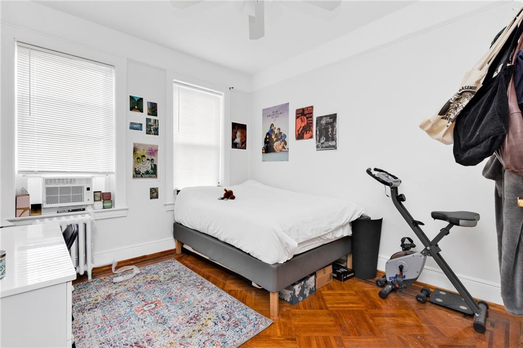 449 Ave Y Brooklyn, NY 11223 - Photo 18 of 25 a room with furniture and a rug