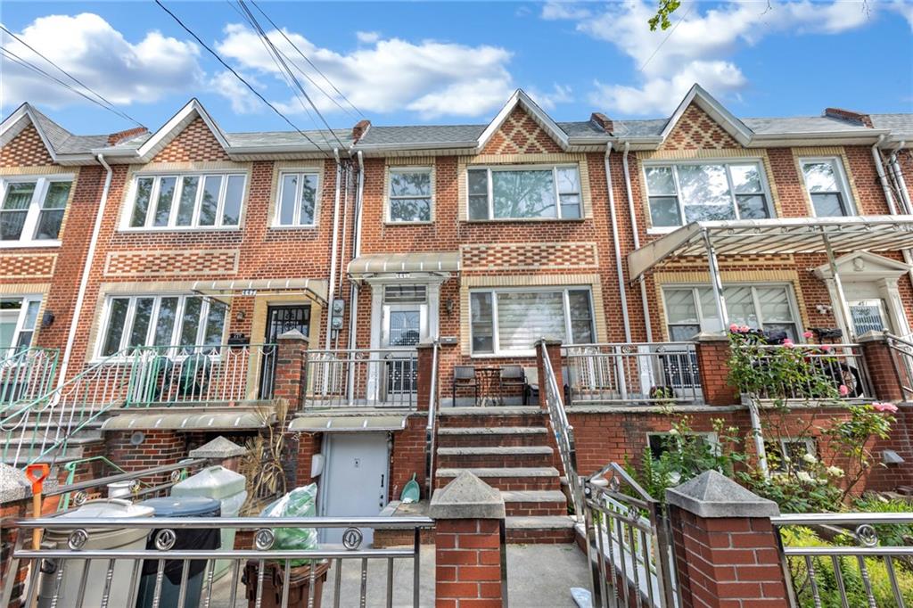 449 Ave Y Brooklyn, NY 11223 - Photo 24 of 25 a front view of a residential apartment building with a yard