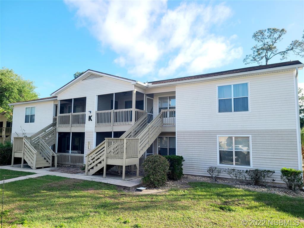 1600 Big Tree Road, Unit K3 South Daytona, FL 32119 - Photo 1 of 4 a front view of a house with a yard