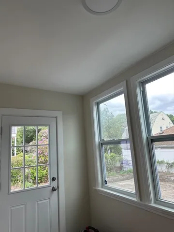 a view of an empty room with a window