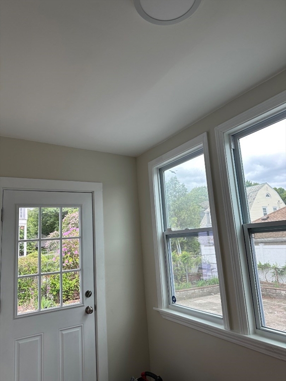 78 Harriet Street, Unit 1 Boston, MA 02135 - Photo 14 of 22 a view of an empty room with a window