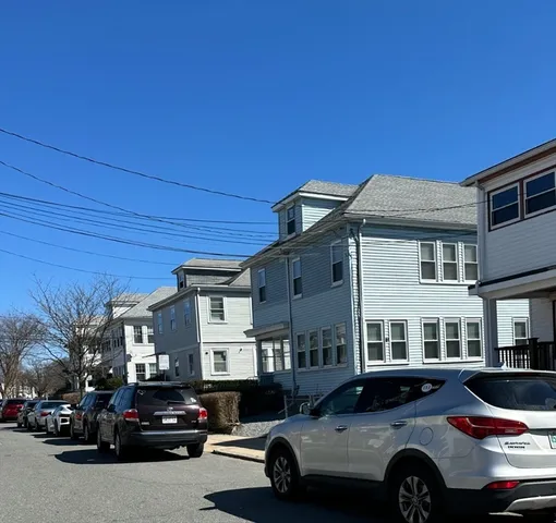 a car parked in front of a house
