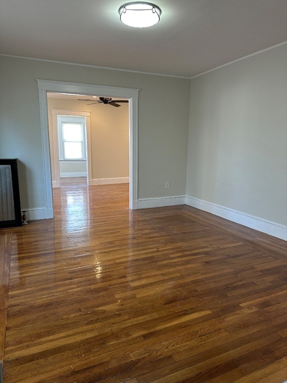 78 Harriet Street, Unit 1 Boston, MA 02135 - Photo 5 of 22 a view of empty room with wooden floor