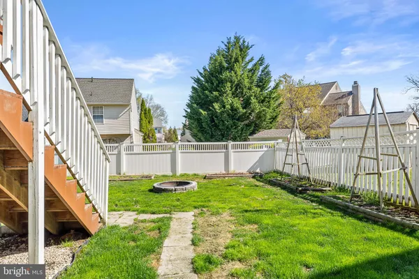 a view of a house with entertaining space and a yard