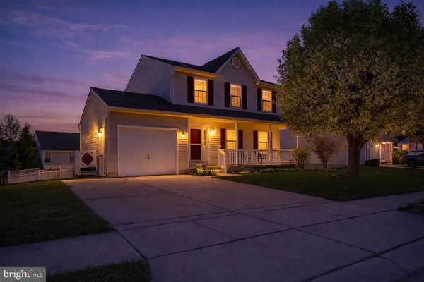 a view of a park with large trees