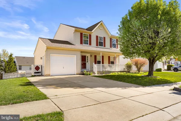 a view of yard with tree and wooden fence