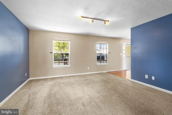 a view of a livingroom with a furniture window and wooden floor