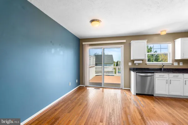 a bathroom with a sink a toilet and a window