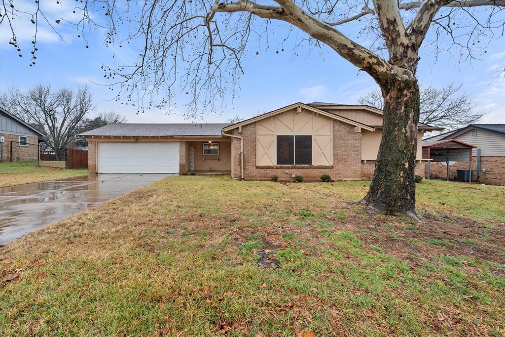806 Ridgeway Road Joshua, TX 76058 - Photo 1 of 27 a front view of a house with a yard and garage
