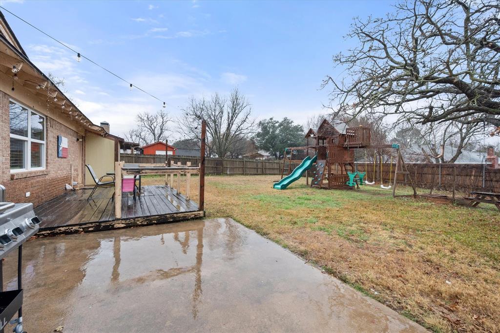 806 Ridgeway Road Joshua, TX 76058 - Photo 23 of 27 a view of a park with swings and slides