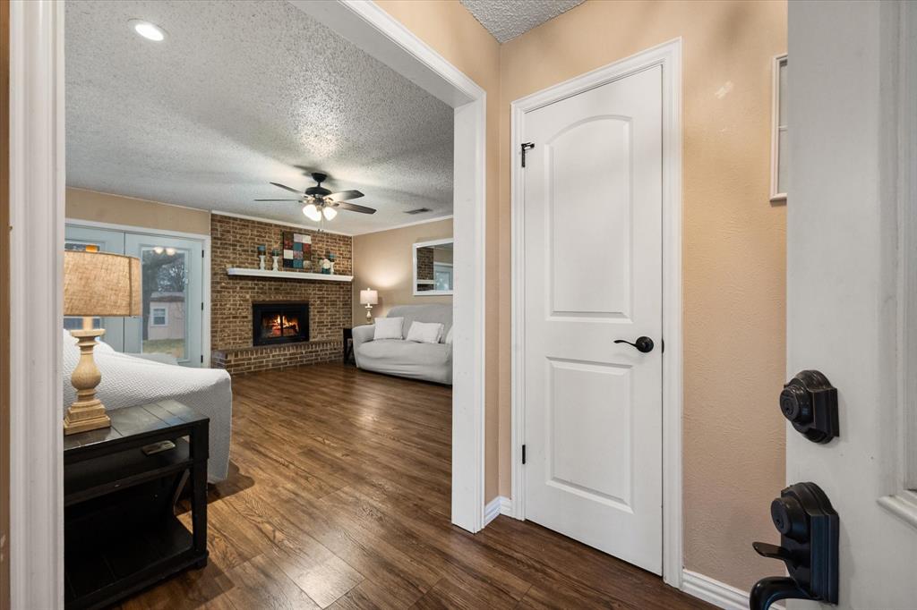 806 Ridgeway Road Joshua, TX 76058 - Photo 3 of 27 a living room with furniture and a fireplace