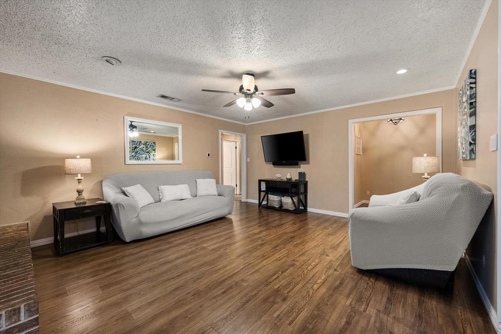 806 Ridgeway Road Joshua, TX 76058 - Photo 5 of 27 a living room with furniture and a flat screen tv