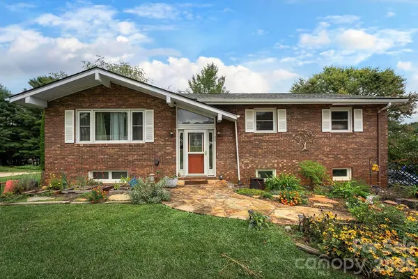 a front view of a house with yard