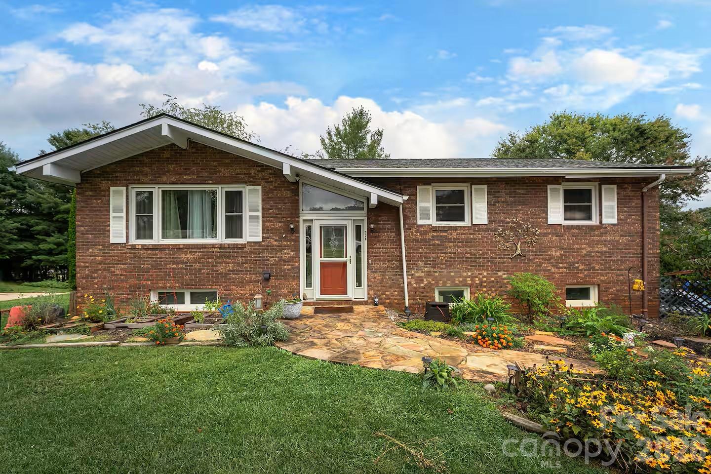 a front view of a house with yard