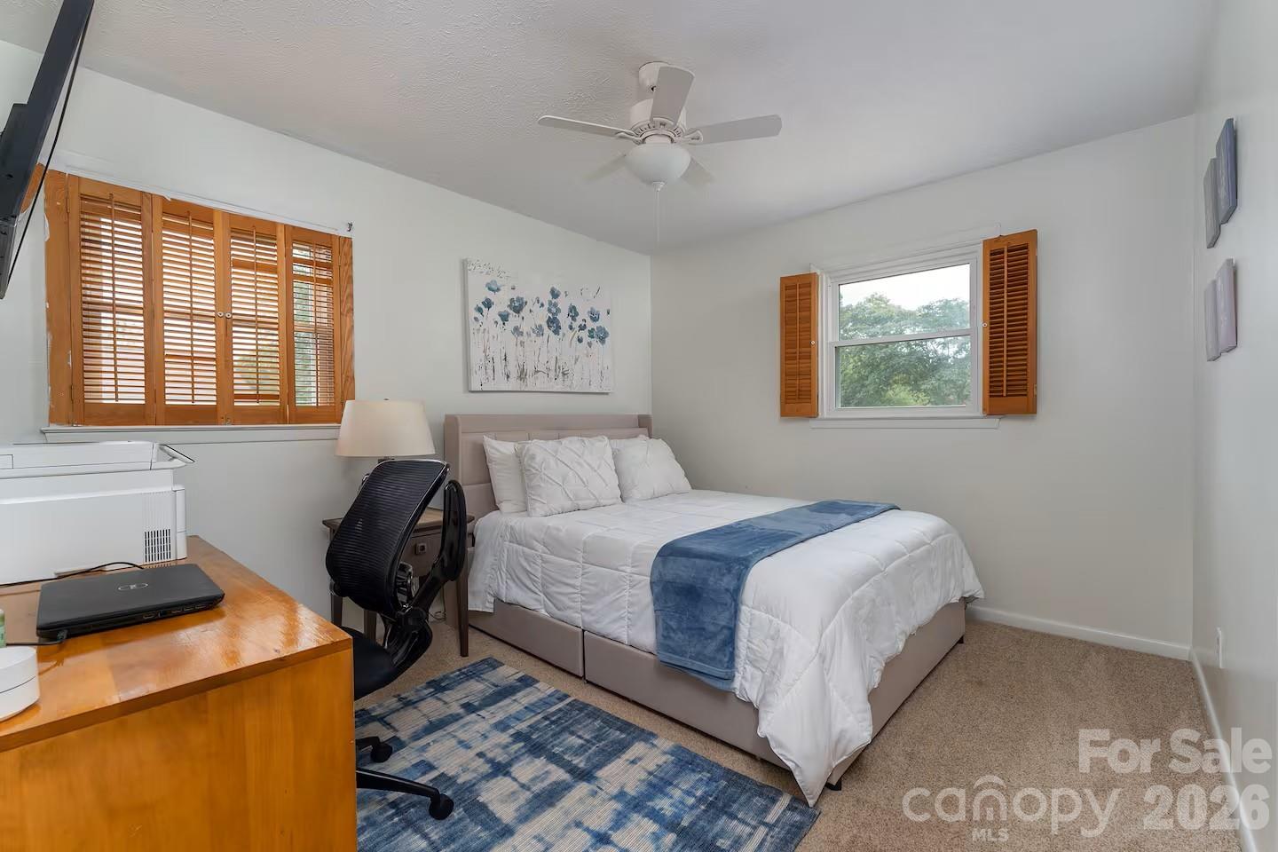 124 Oak Hill Road Candler, NC 28715 - Photo 14 of 29 a bedroom with a bed and a window
