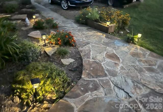 124 Oak Hill Road Candler, NC 28715 - Photo 2 of 29 a view of a garden with a fountain