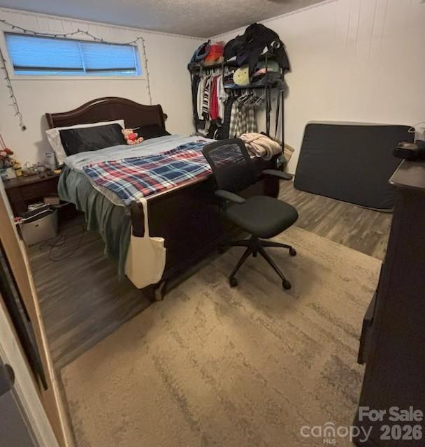 124 Oak Hill Road Candler, NC 28715 - Photo 25 of 29 a bedroom with a bed and dresser