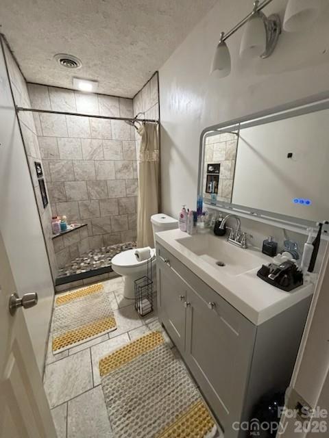124 Oak Hill Road Candler, NC 28715 - Photo 26 of 29 a bathroom with a sink a toilet and a mirror