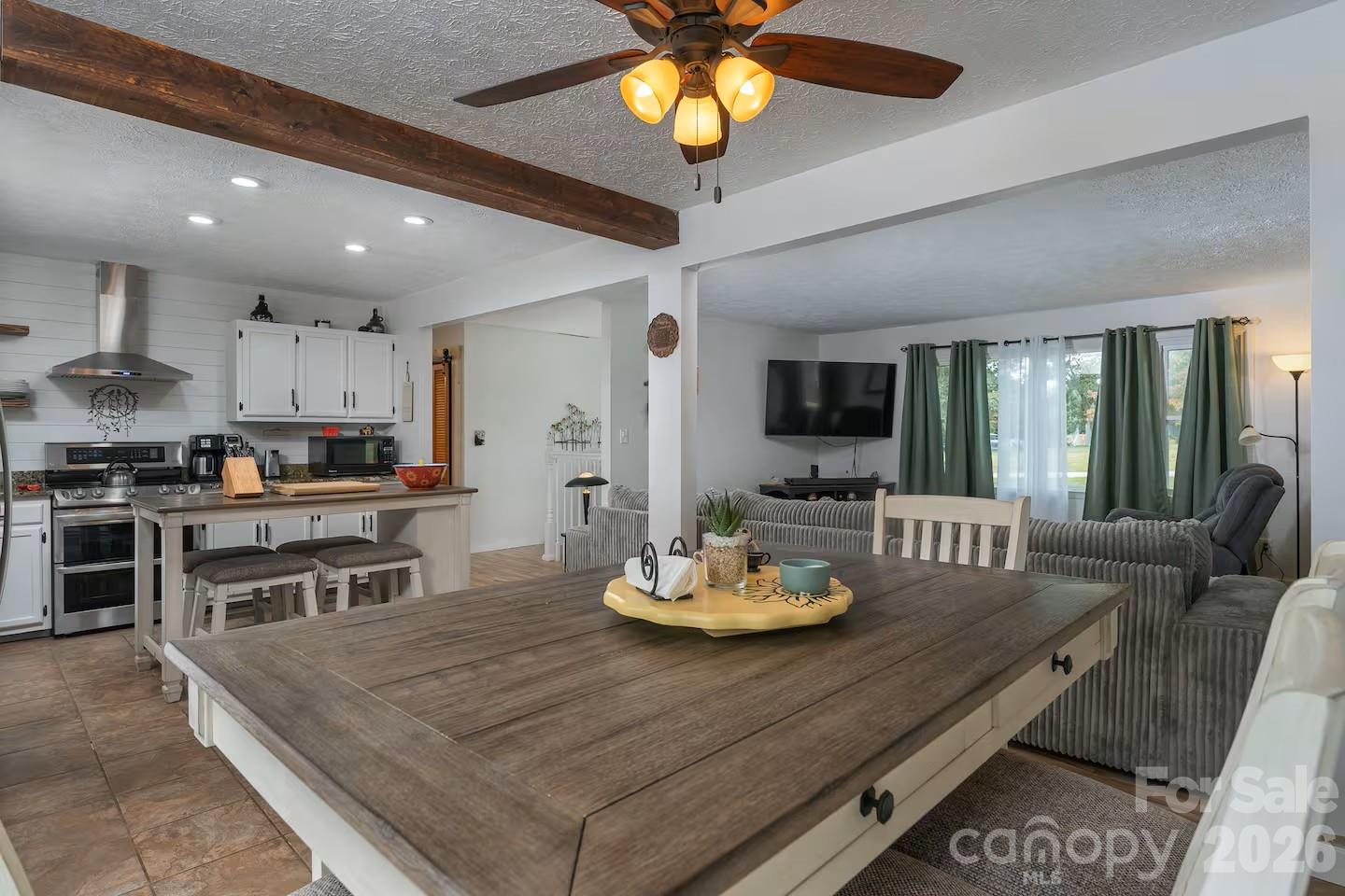 124 Oak Hill Road Candler, NC 28715 - Photo 8 of 29 a living room with stainless steel appliances kitchen island furniture and a kitchen view