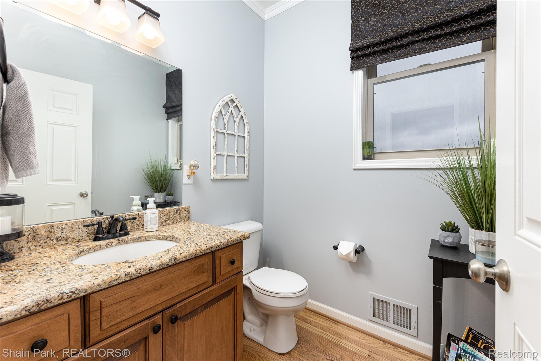 196 Londonderry Lane Rochester, MI 48306 - Photo 20 of 55 Half-bath in Entry level with granite and Lafata Cabinents.