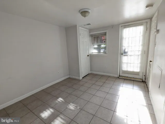 a view of an empty room and window