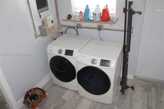 a utility room with dryer and washer