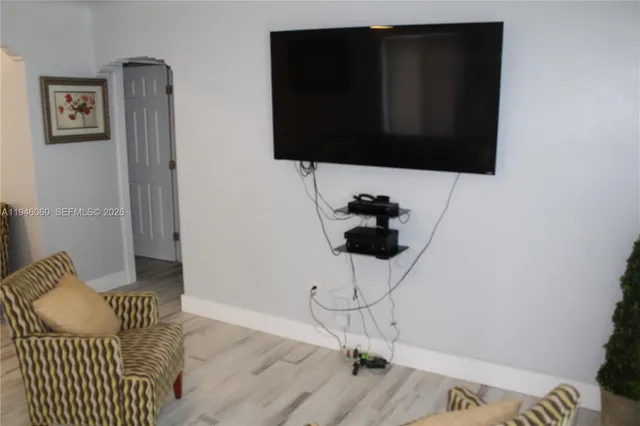 a living room with a couch and a flat screen tv