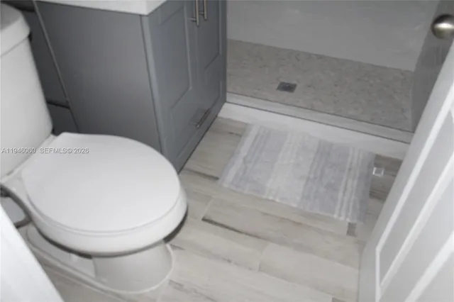 a bathroom with a toilet and a bathtub