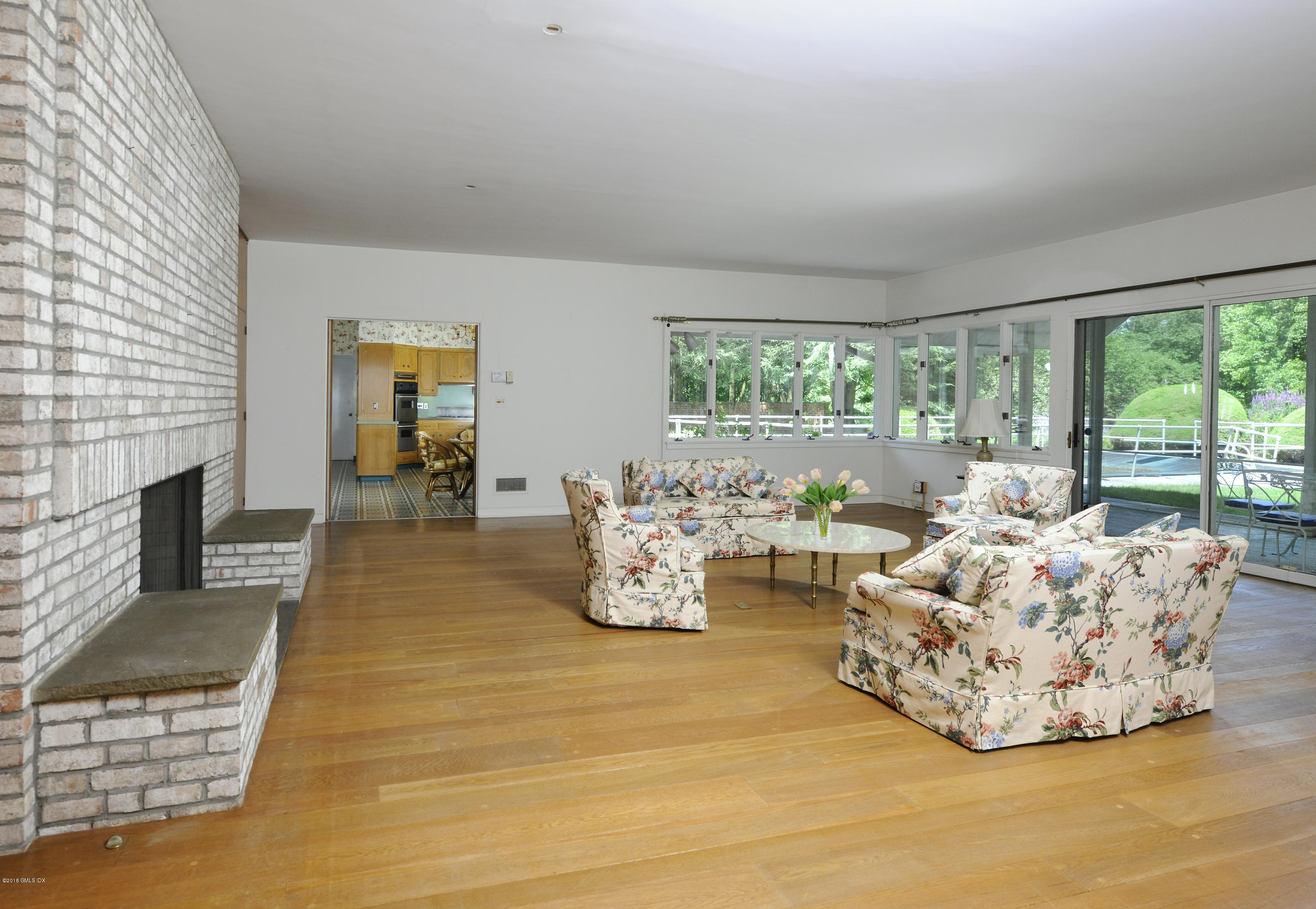 7 Dempsey Lane Greenwich, CT 06830 - Photo 11 of 22 a living room with furniture and a fireplace
