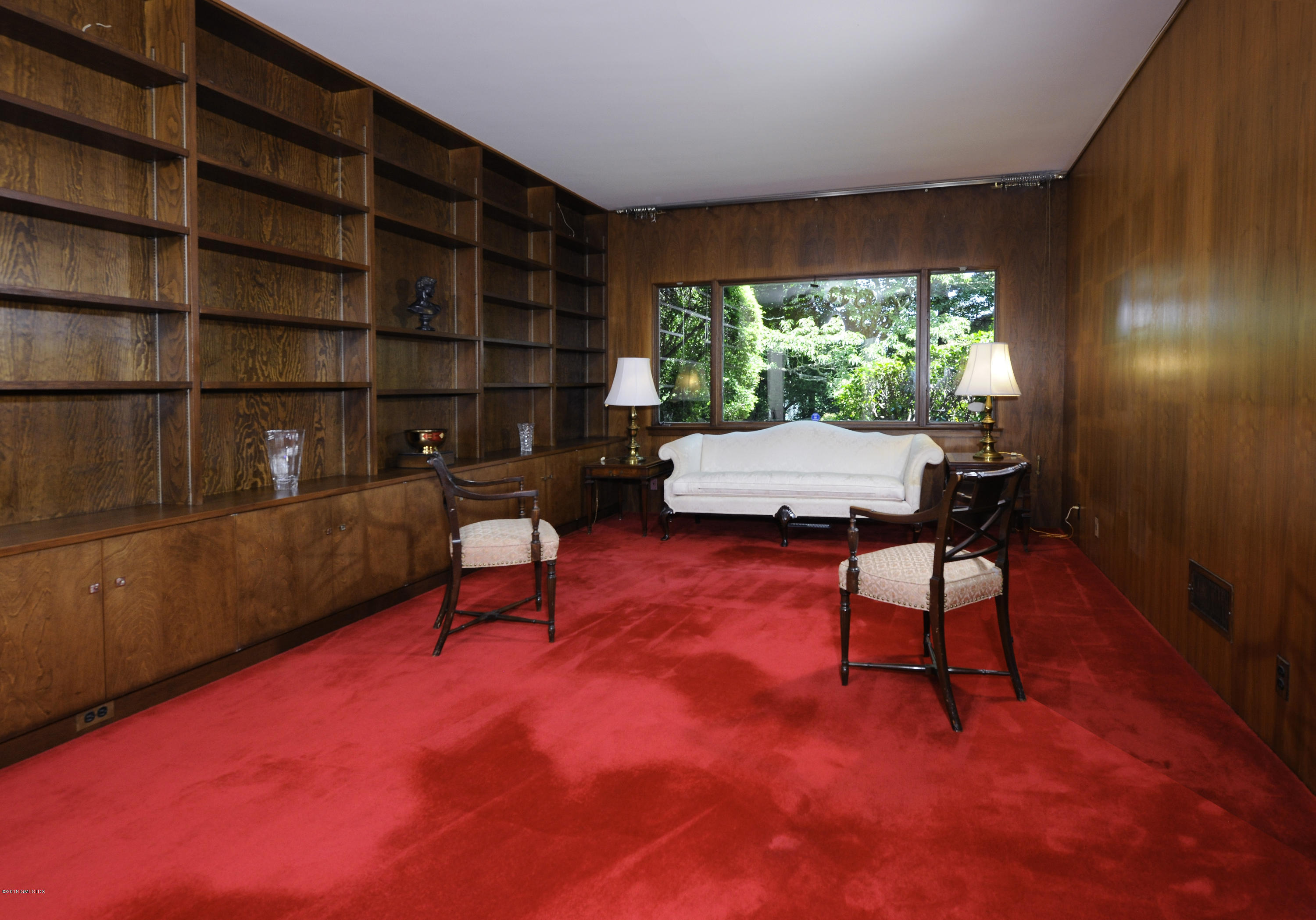 7 Dempsey Lane Greenwich, CT 06830 - Photo 16 of 22 a living room with furniture and a large window