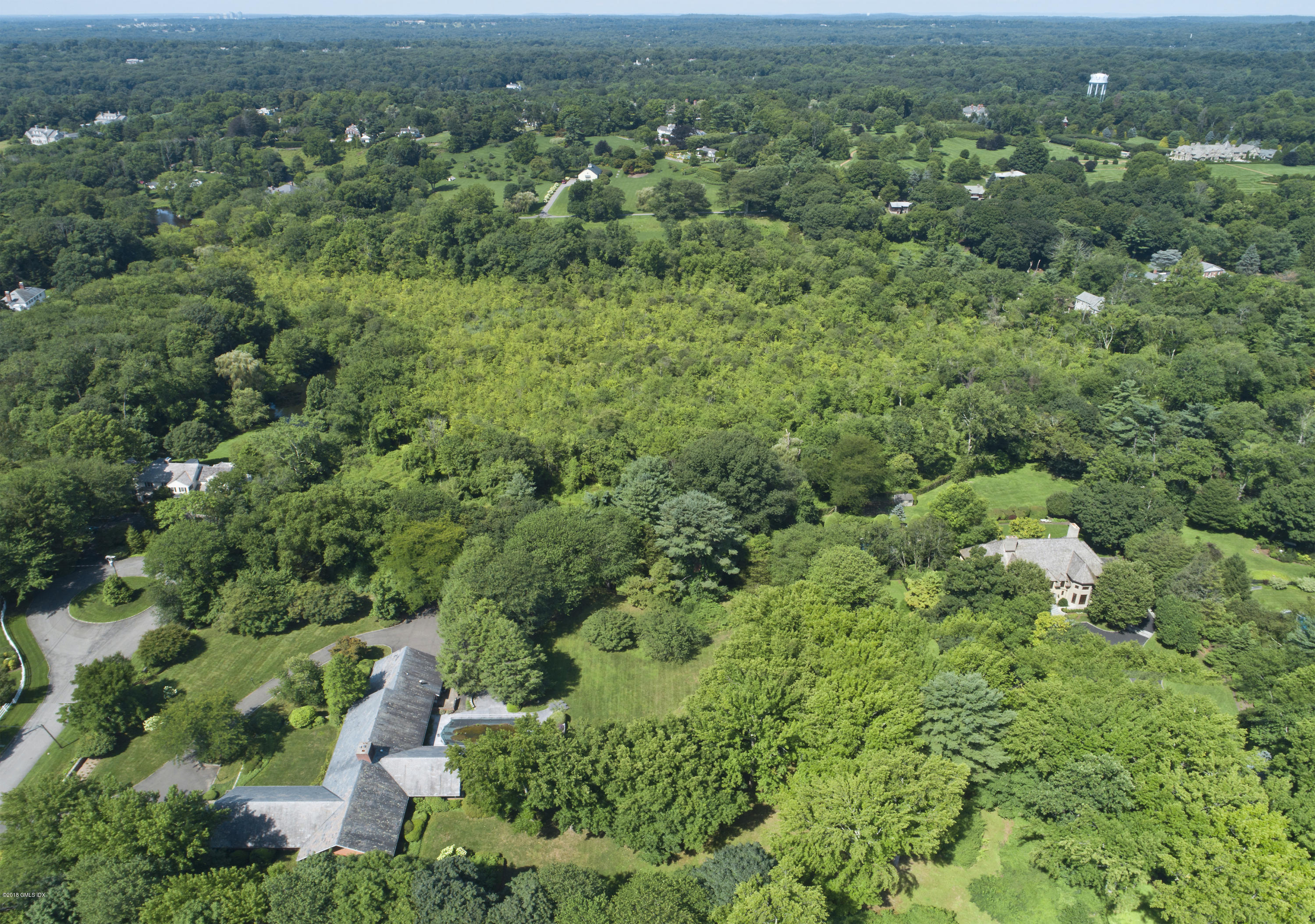 7 Dempsey Lane Greenwich, CT 06830 - Photo 17 of 22 an aerial view of residential houses with outdoor space and trees