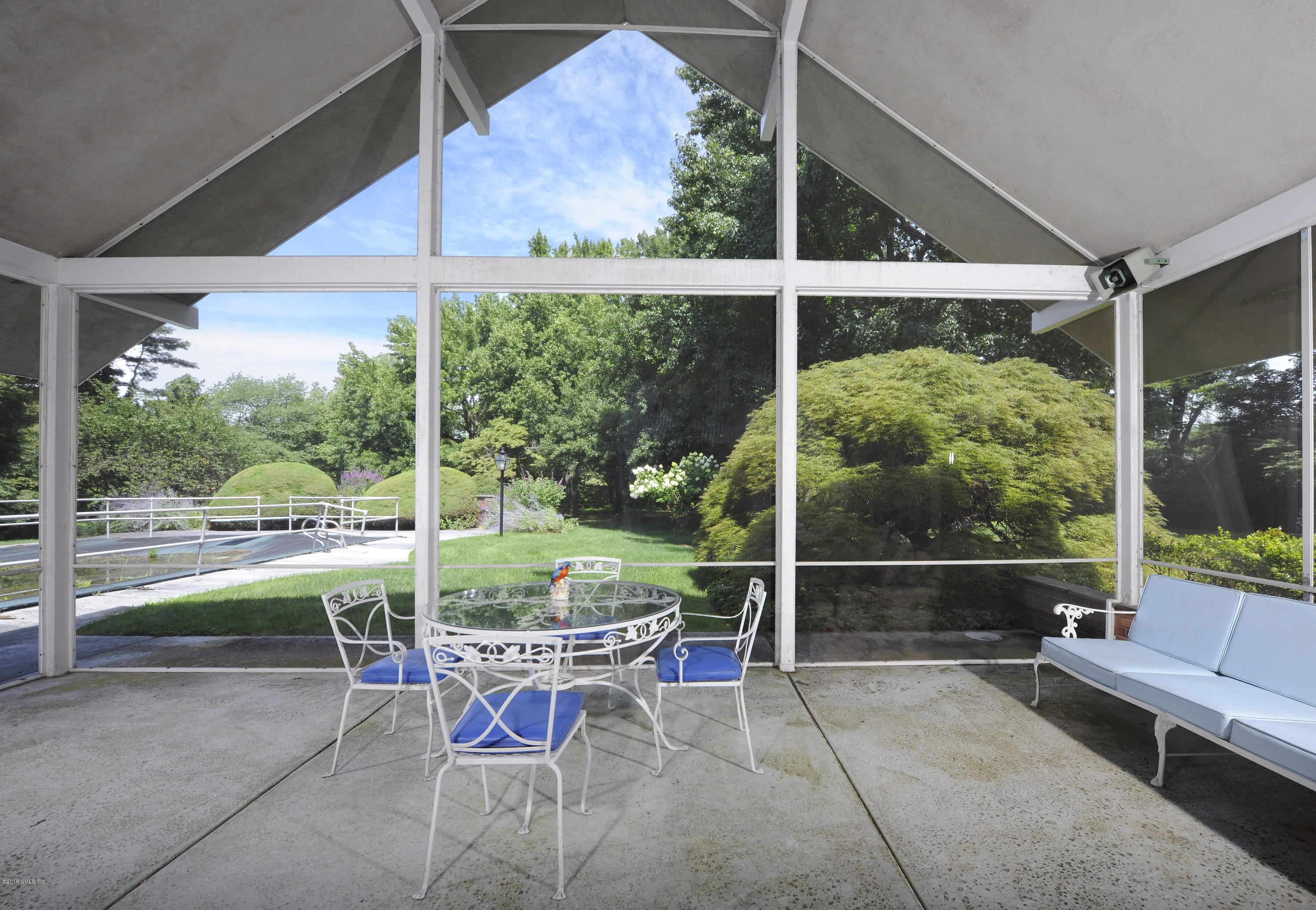 7 Dempsey Lane Greenwich, CT 06830 - Photo 6 of 22 a view of a porch with chairs and backyard