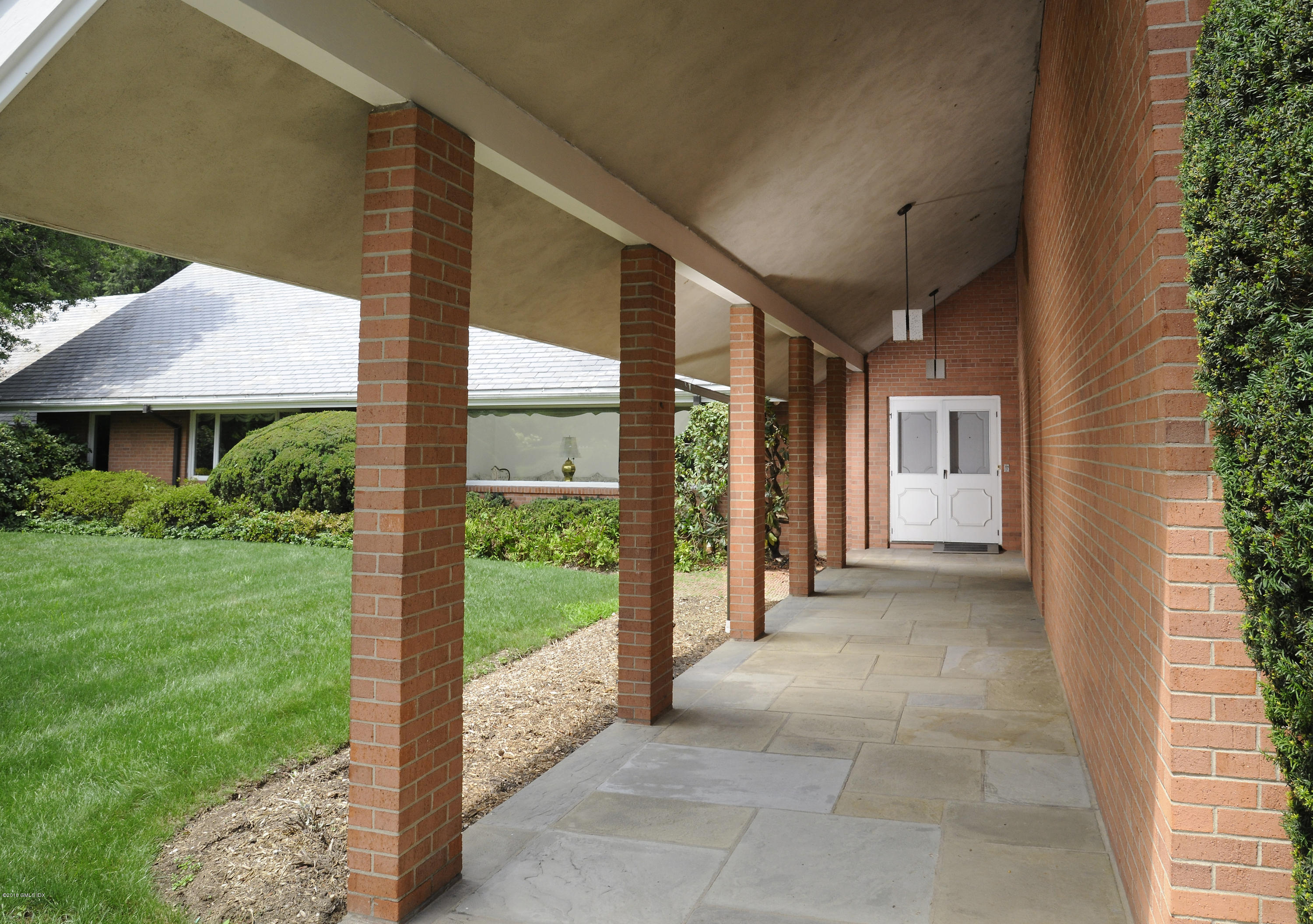 7 Dempsey Lane Greenwich, CT 06830 - Photo 7 of 22 a view of a house with backyard and porch