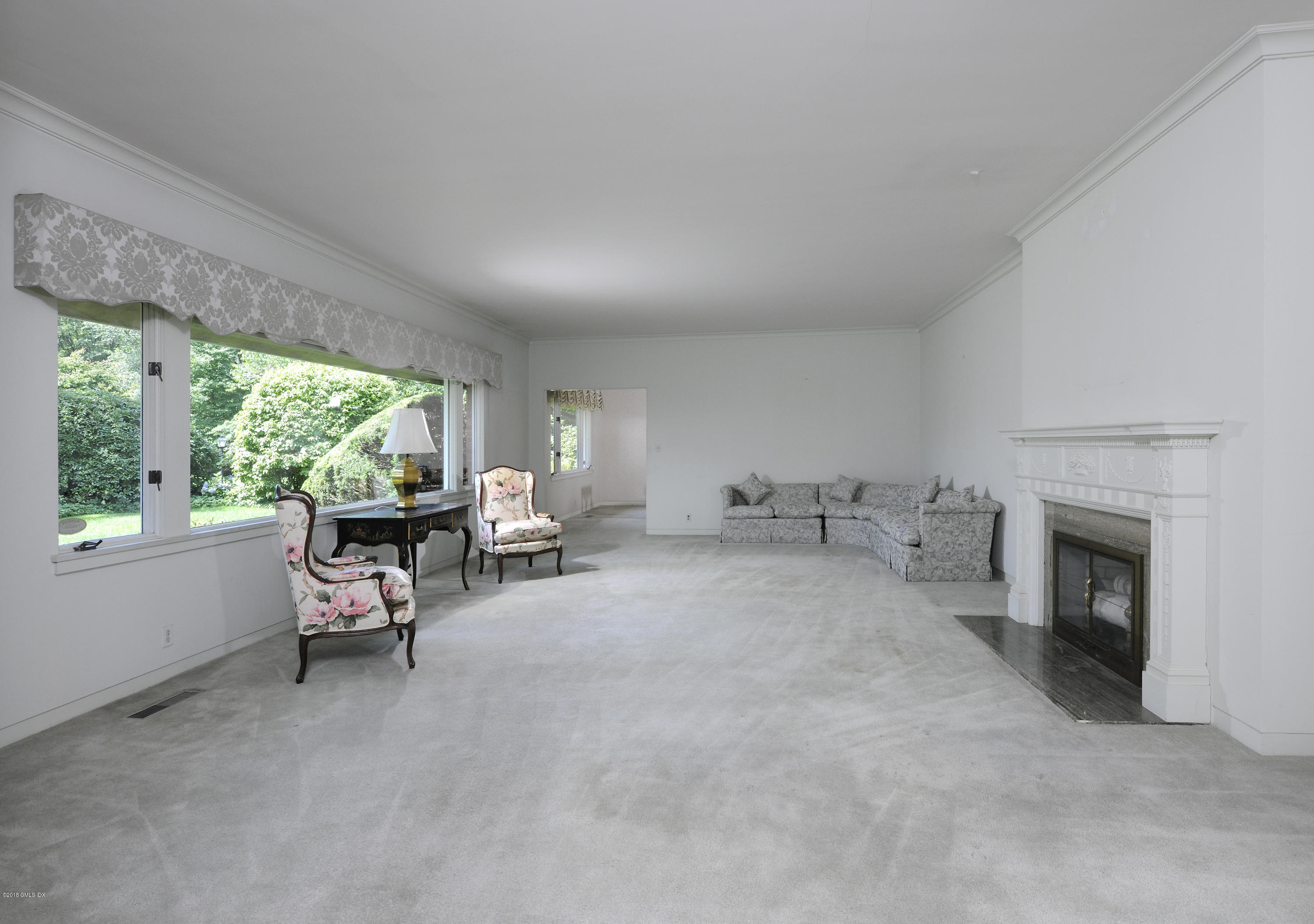 7 Dempsey Lane Greenwich, CT 06830 - Photo 9 of 22 a living room with furniture and a fireplace