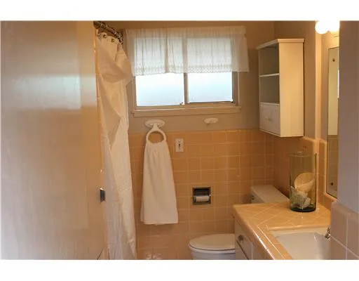 a kitchen with a sink and stove top oven