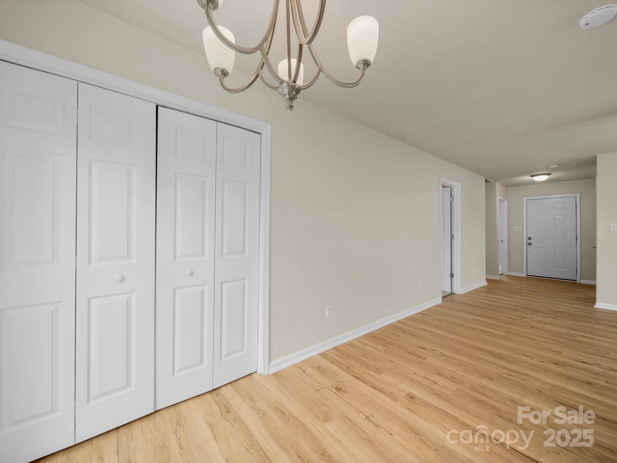6420 Sunman Road Charlotte, NC 28216 - Photo 11 of 43 a view of empty room with wooden floor