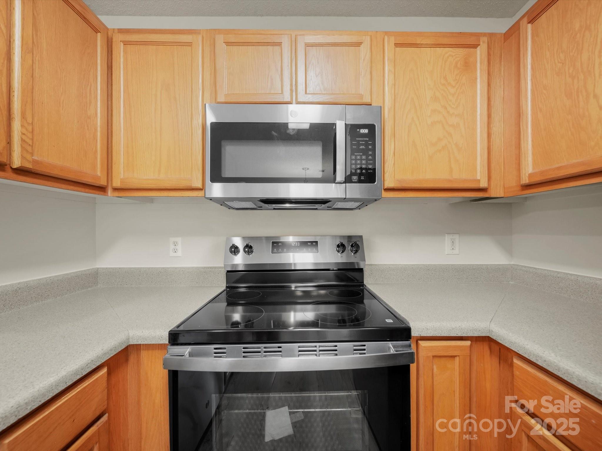 6420 Sunman Road Charlotte, NC 28216 - Photo 13 of 43 a stove top oven sitting inside of a kitchen