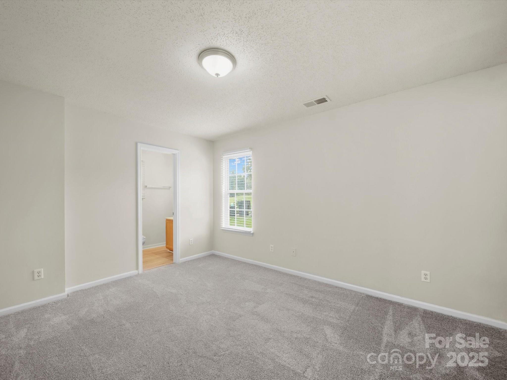 6420 Sunman Road Charlotte, NC 28216 - Photo 16 of 43 a view of an empty room with a window