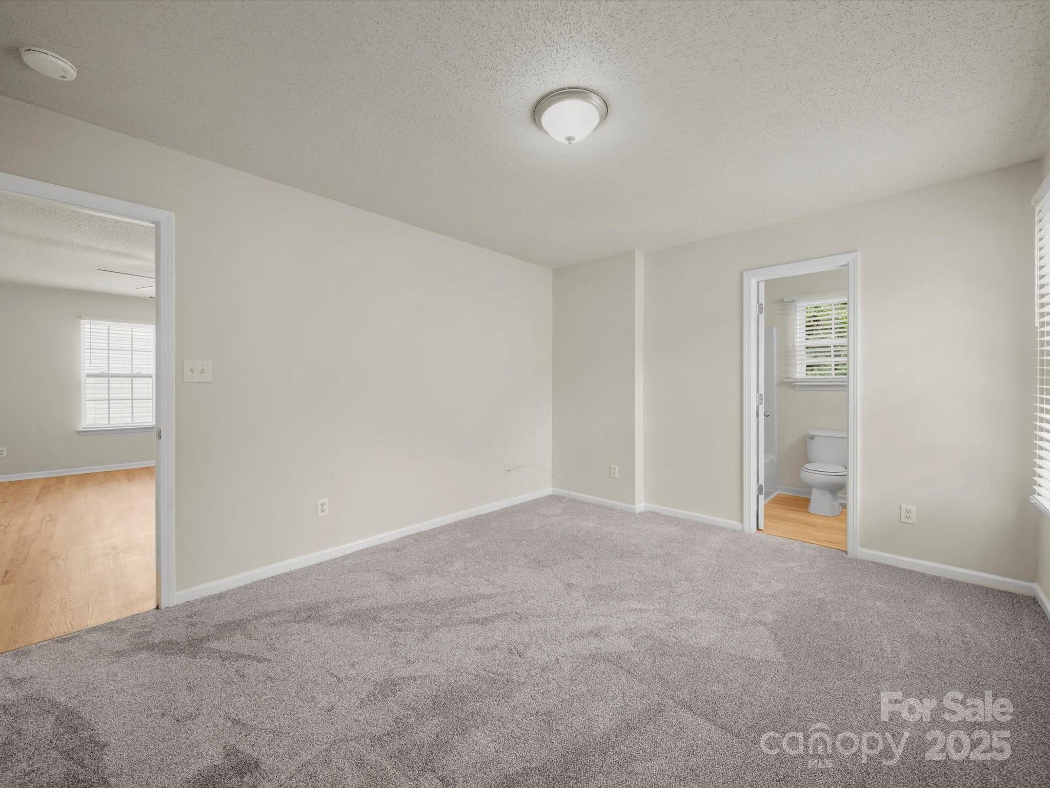 6420 Sunman Road Charlotte, NC 28216 - Photo 17 of 43 an empty room with windows